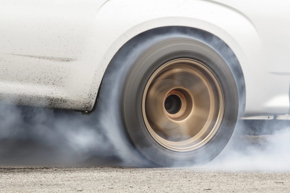 B body car doing a burn out at the track