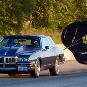 open parachute on back of car